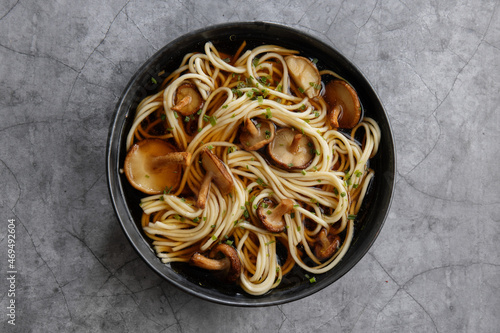 Asian noodles with mushrooms in bowl