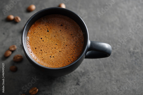 Coffee beans in small bowls on wooden