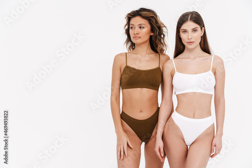 Two young woman in underwear standing