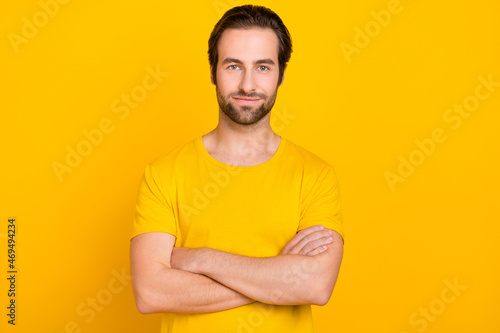 Photo of young guy smart crossed hands agent wear casual clothes isolated over yellow color background