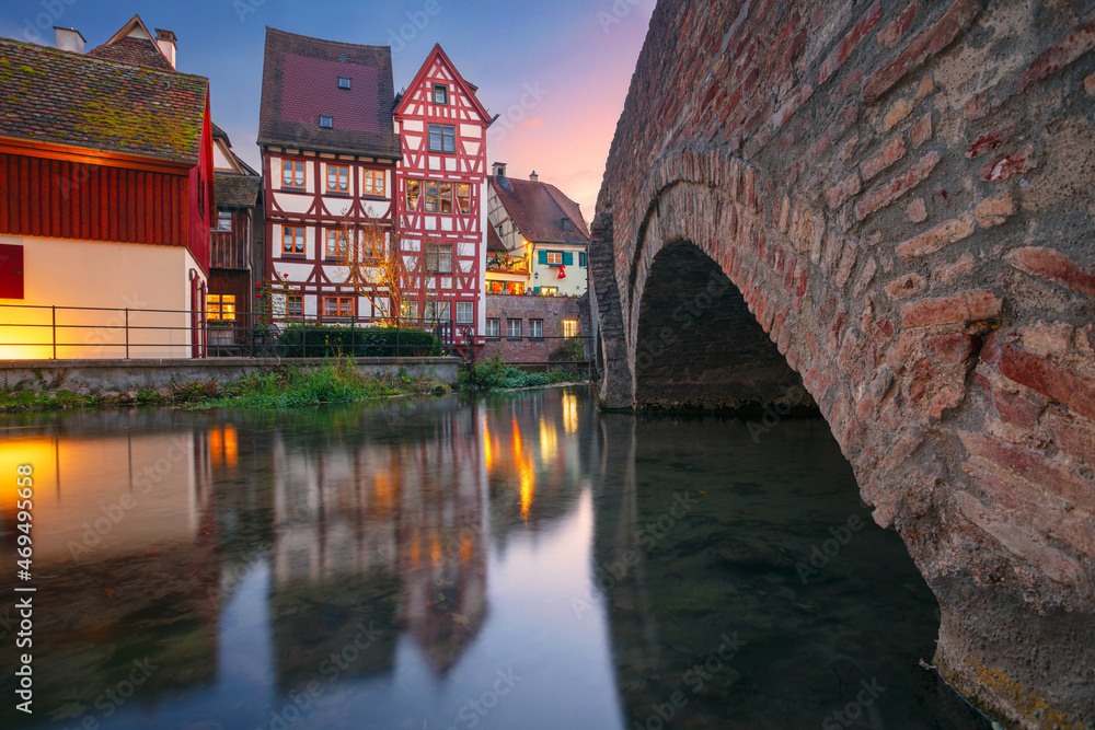 Ulm, Germany. Cityscape image of old town street of Ulm, Germany with traditional Bavarian architecture at autumn sunset.