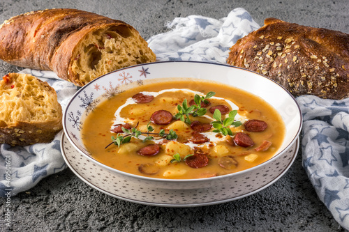 Traditional Frankfurter soup with fried sausages, potatoes and paprika