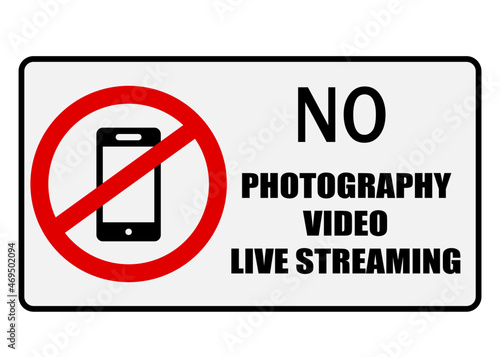 No photography, video or live streaming. Prohibition sign with a smartphone inside the ban circle and text.