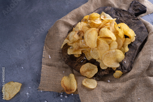 natural potato chips on a gray concrete background