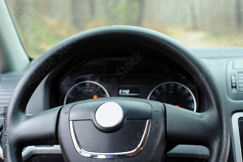 auto steering wheel. Car instrument panel. speedometer and tachometer auto. modern sports car. illumination of measuring instruments. steering wheel close-up © Oleksandr Filatov