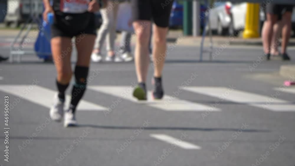 Defocused marathon runners in slow motion 180fps Defocused marathon runners in slow motion 180fps
