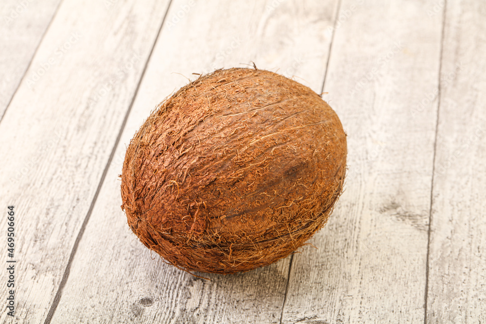 Tropical brown coconut over background Tropical brown coconut over background