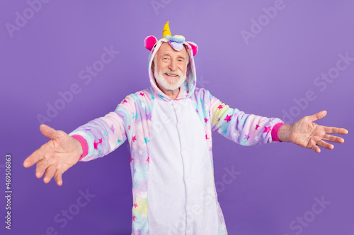 Photo of excited charming retired man nightwear overall want hug you smiling isolated purple color background