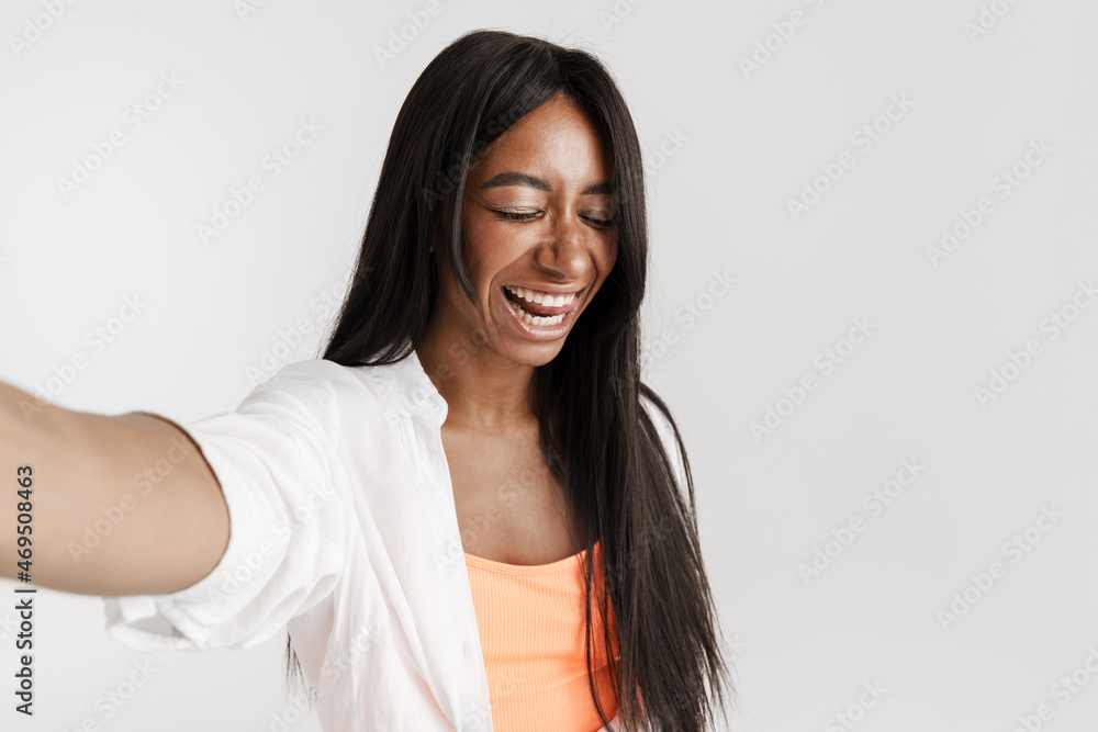 Smiling young african woman with long dark hair Smiling young african woman with long dark hair