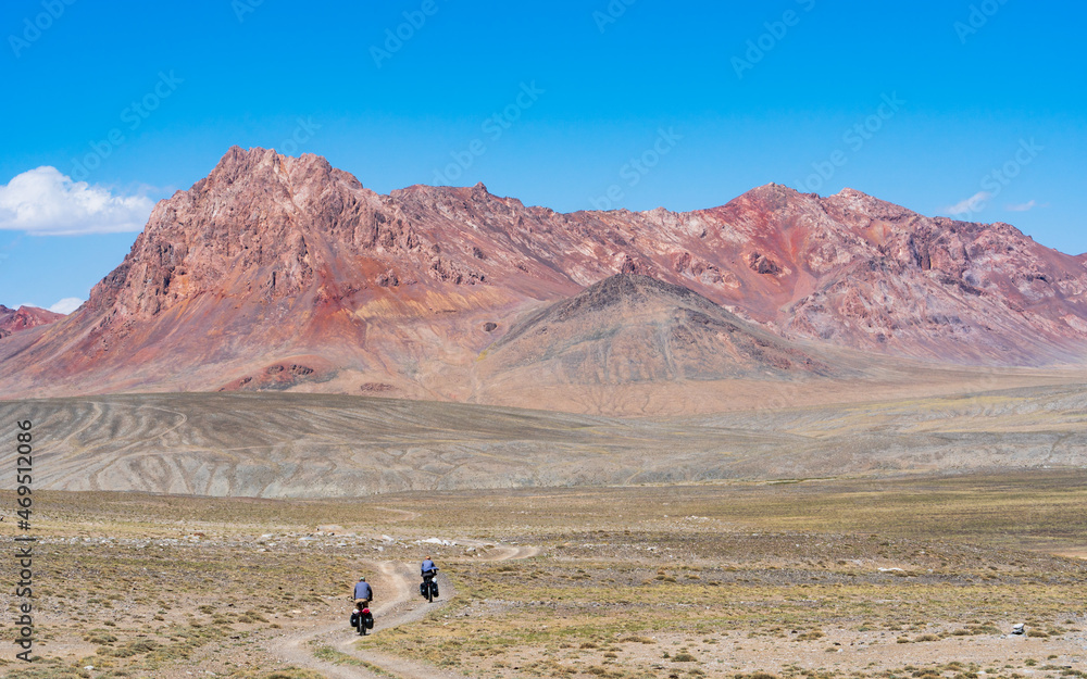 Vivid red mountains in the Zorgul area of Tajikistan, showcasing the region's dramatic geology.
Vivid red mountains in the Zorgul area of Tajikistan, showcasing the region's dramatic geology.