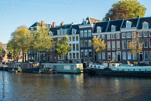 canal with boats and houses in Amsterdam 