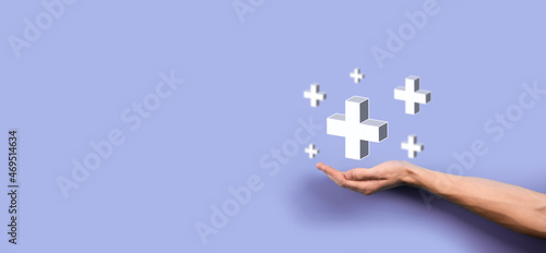 Businessman, man hold in hand offer positive thing such as profit, benefits, development, CSR represented by plus sign.The hand shows the plus sign © Ivan