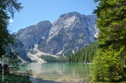Fototapeta Naklejka Na Ścianę i Meble -  Lake Braies (also known as Pragser Wildsee or Lago di Braies) in Dolomites Mountains, Sudtirol, Italy. Romantic place with typical wooden boats on the alpine lake. Hiking travel and adventure.