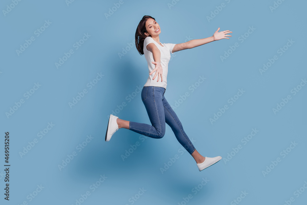 Portrait of adorable charming cute lady jump run hands invite embrace on blue background