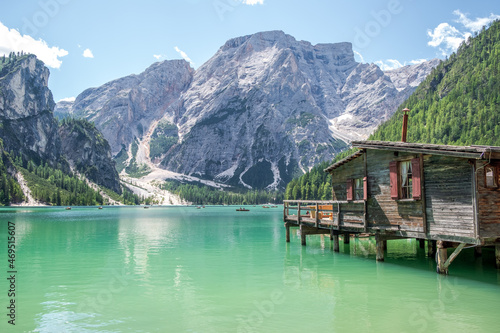 Lake Braies (also known as Pragser Wildsee or Lago di Braies) in Dolomites Mountains, Sudtirol, Italy. Romantic place with typical wooden boats on the alpine lake. Hiking travel and adventure.