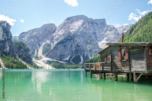 Lake Braies (also known as Pragser Wildsee or Lago di Braies) in Dolomites Mountains, Sudtirol, Italy. Romantic place with typical wooden boats on the alpine lake. Hiking travel and adventure.