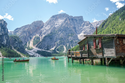 Lake Braies (also known as Pragser Wildsee or Lago di Braies) in Dolomites Mountains, Sudtirol, Italy. Romantic place with typical wooden boats on the alpine lake. Hiking travel and adventure.