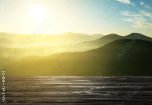 Empty wooden surface and beautiful view of mountain landscape on sunny day. Space for design