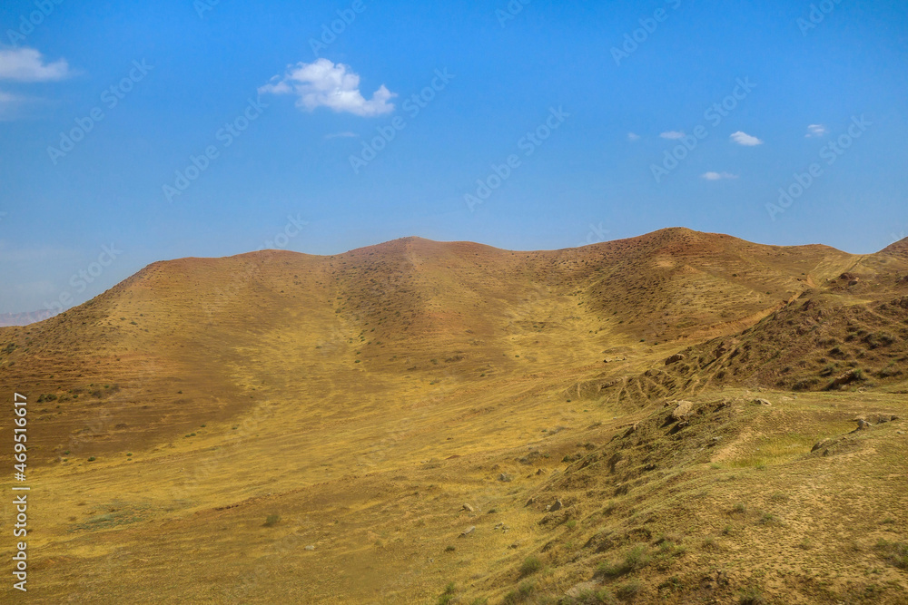 Hilly valley, scorched by the sun, at the foot of the Gissar range. Shot in the Surkhandarya region of southern Uzbekistan