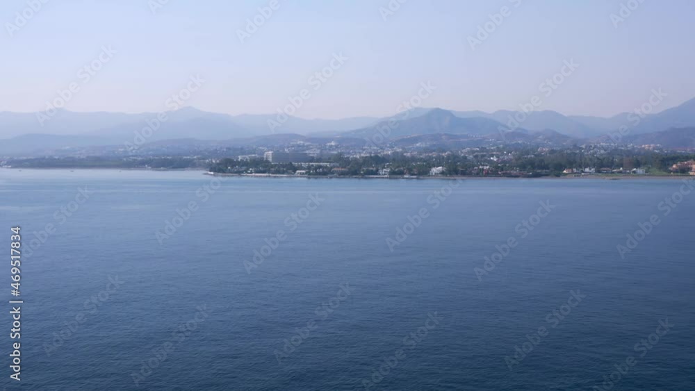Smooth movement into waking up city near calm coast Smooth movement into waking up city near calm coast