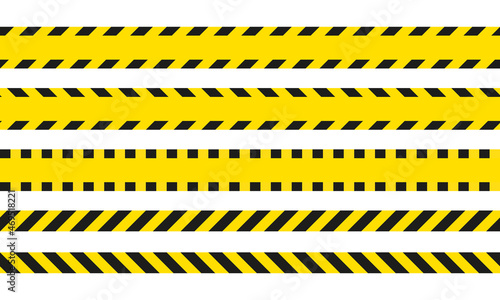 Yellow and black danger ribbons. Police line, crime scene, do not cross, construction site road © zanna_