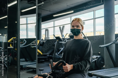 Fitness,sports.fit,Girl in mask fitness gym opening lockdown covid passport,QR cod Wellness, health care,generation z sports recreation concept online fitness apps. workout,training,Fit wellness