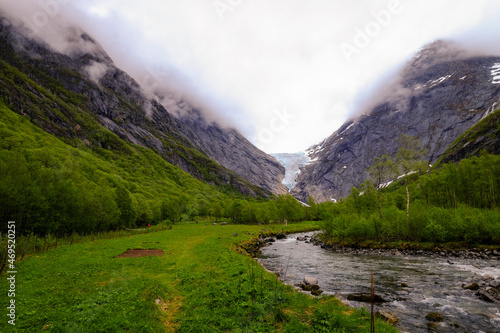 A glacial stream flows from the Briksdal glacier, Stryn, Vestland, Norway, Scandinavia photo