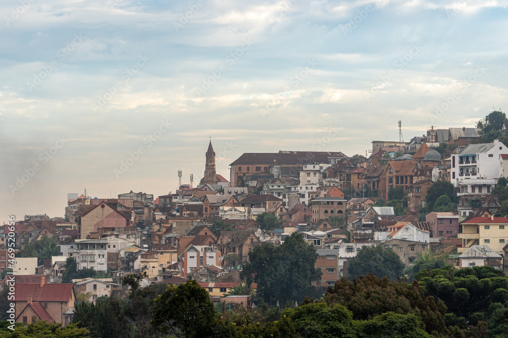 An elevated view of Antananarivo at dusk, with traditional houses cascading down the hillside and capturing the essence of the capital. An elevated view of Antananarivo at dusk, with traditional houses cascading down the hillside and capturing the essence of the capital.
