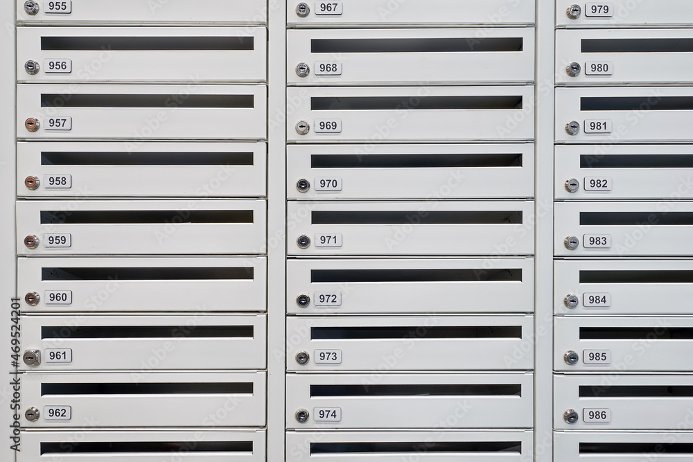 A lot of new mailboxes in an apartment building. New building