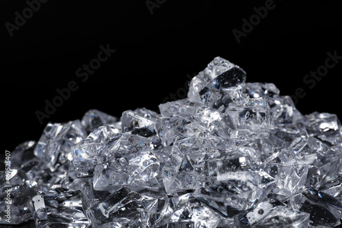 Pile of crushed ice on black background, closeup