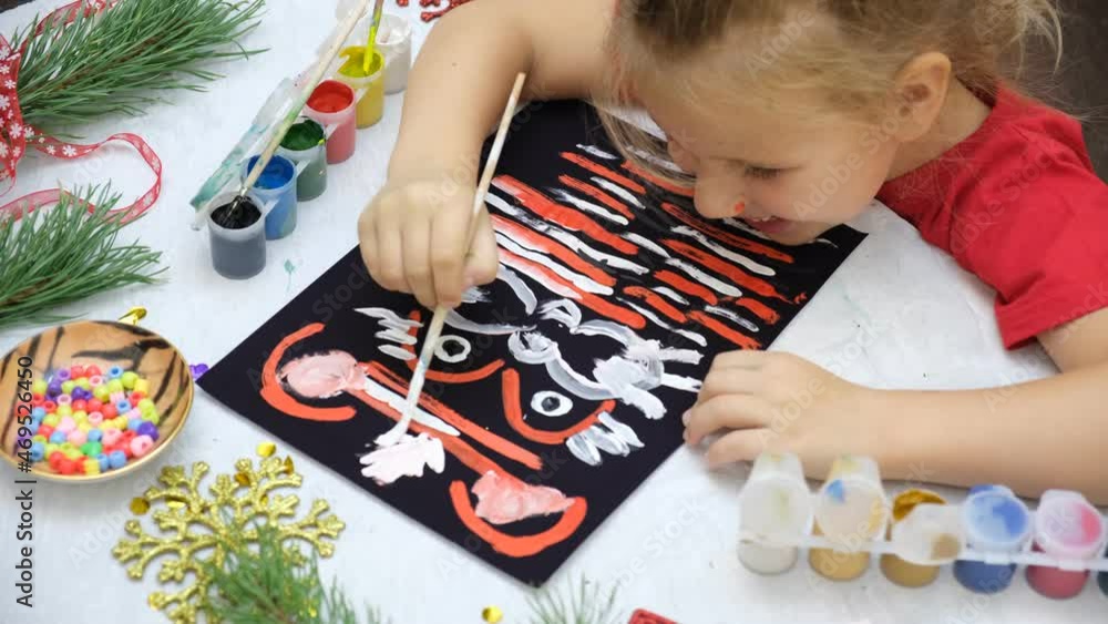 Child making funny card with symbol of 2022, painting tiger. creativity game. DIY craft. Child making funny card with symbol of 2022, painting tiger. creativity game. DIY craft.