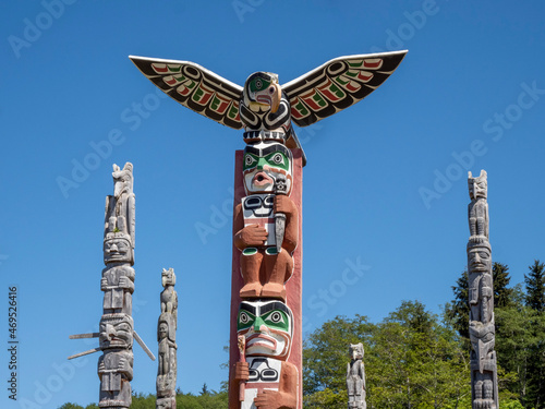 Kwakwaka'wakw totem poles in the cemetery in Alert Bay, Cormorant Island, British Columbia, Canada photo