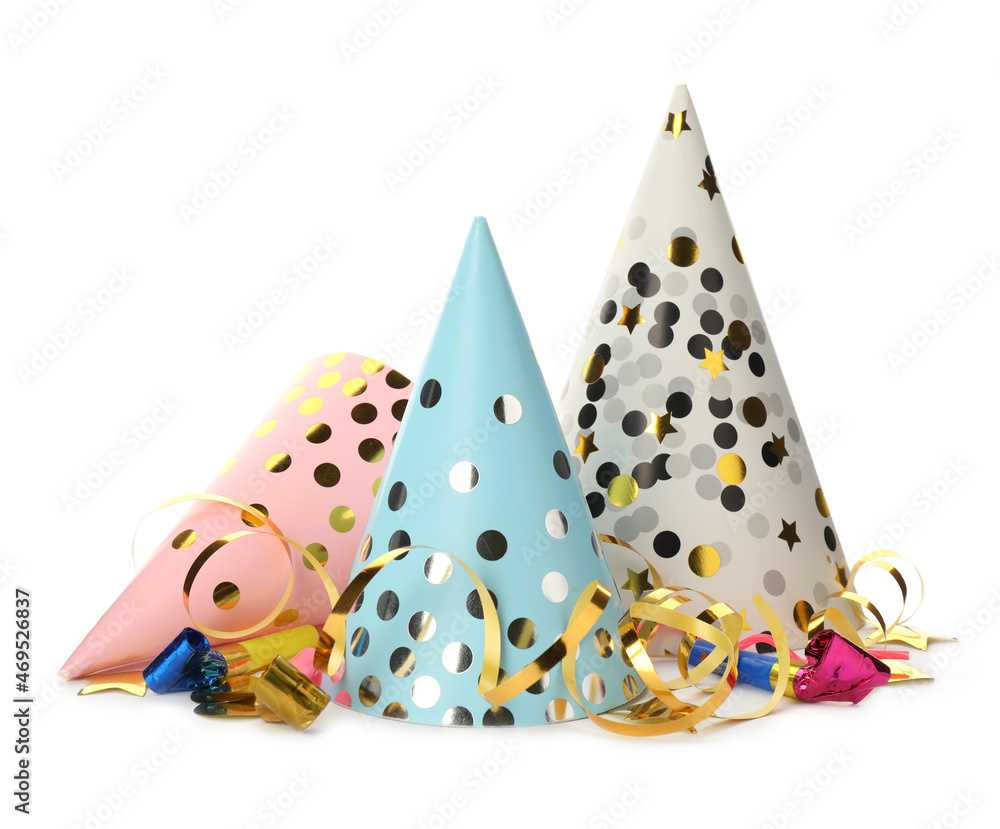 Colorful party hats, blowers and confetti streamers on white background