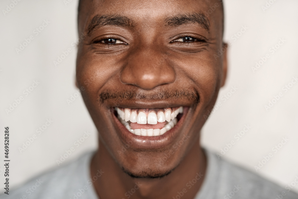 Closeup of a carefree young African man laughing Closeup of a carefree young African man laughing
