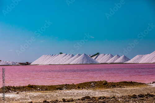View of the pink colored ocean overlooking the Salt Pyramids of Bonaire from afar, Bonaire, Netherlands Antilles, Caribbean, Central America