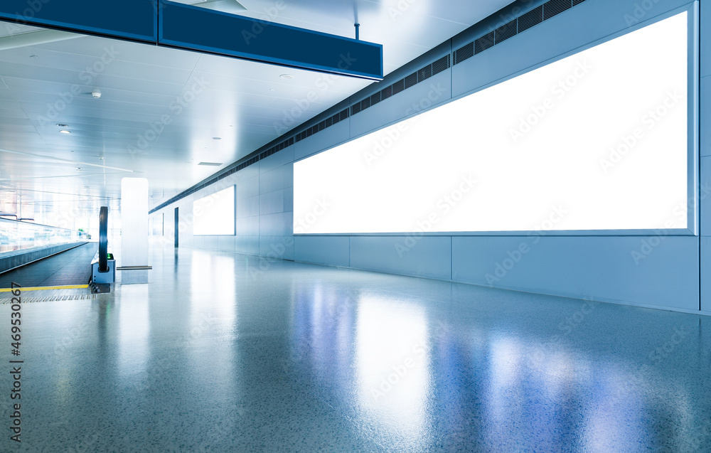 Blank billboard and escalator at a international airport Blank billboard and escalator at a international airport