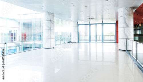 Empty long corridor in modern office building