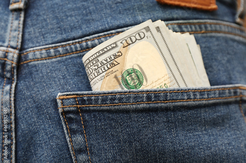 Foto Dollar banknotes in pocket of jeans, closeup. Spending money