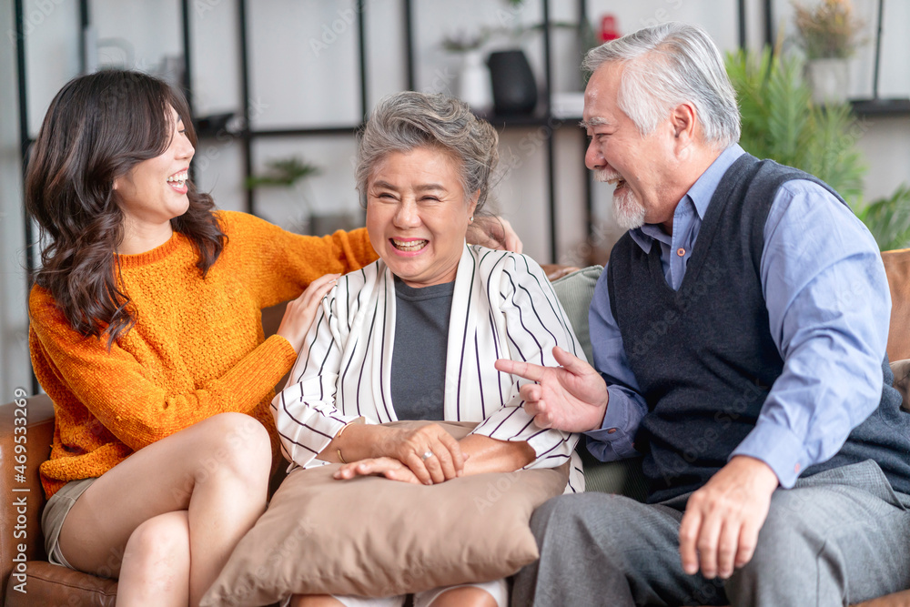happiness asian family candid of daughter hug grandparent mother farther senior elder cozy relax on sofa couch surprise visiting in living room at home,together hug cheerful asian family at home happiness asian family candid of daughter hug grandparent mother farther senior elder cozy relax on sofa couch surprise visiting in living room at home,together hug cheerful asian family at home