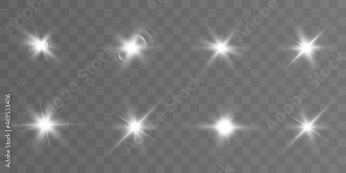 Realistic collection of bright light effects, sparkling stars on a transparent background. Vector