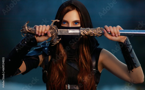 close-up portrait fantasy woman warrior assassin holding dagger in hands, hiding face behind mask. Redhead girl, blue eyes. Black leather costume. Fantastic Ninja soldier with knife sword armor hood