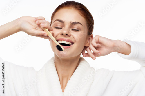Woman in white coat toothbrush oral hygiene