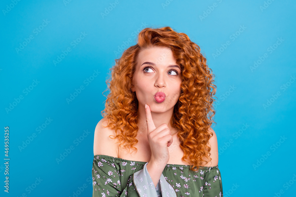 Photo of young attractive girl pouted lips send air kiss dreamy look empty space isolated over blue color background Photo of young attractive girl pouted lips send air kiss dreamy look empty space isolated over blue color background