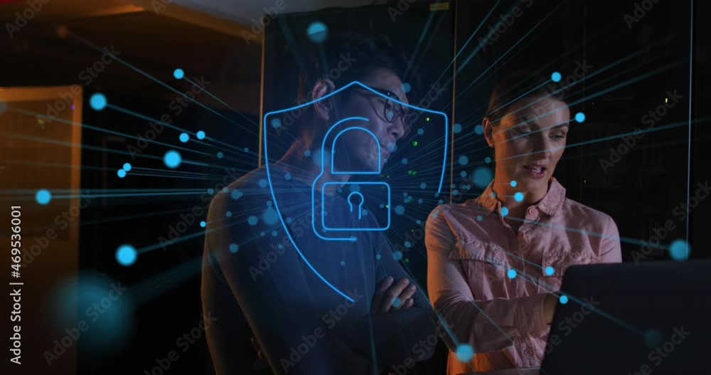 Animation of padlock ver diverse male and female it engineers with laptop by computer server Animation of padlock ver diverse male and female it engineers with laptop by computer server