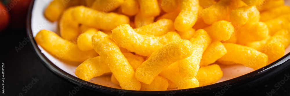 corn sticks cheesy taste spices cheese meal snack on the table copy space food background rustic. top view corn sticks cheesy taste spices cheese meal snack on the table copy space food background rustic. top view