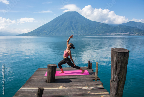 Morning yoga on the dock, San Marcos, Lake Atitlan, Guatemala photo