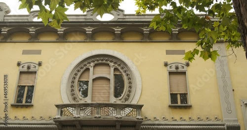 Secessionist house. Circular window of a secessionist house.Quaroni house in Novara inspired by the principles of the Viennese secession.  photo