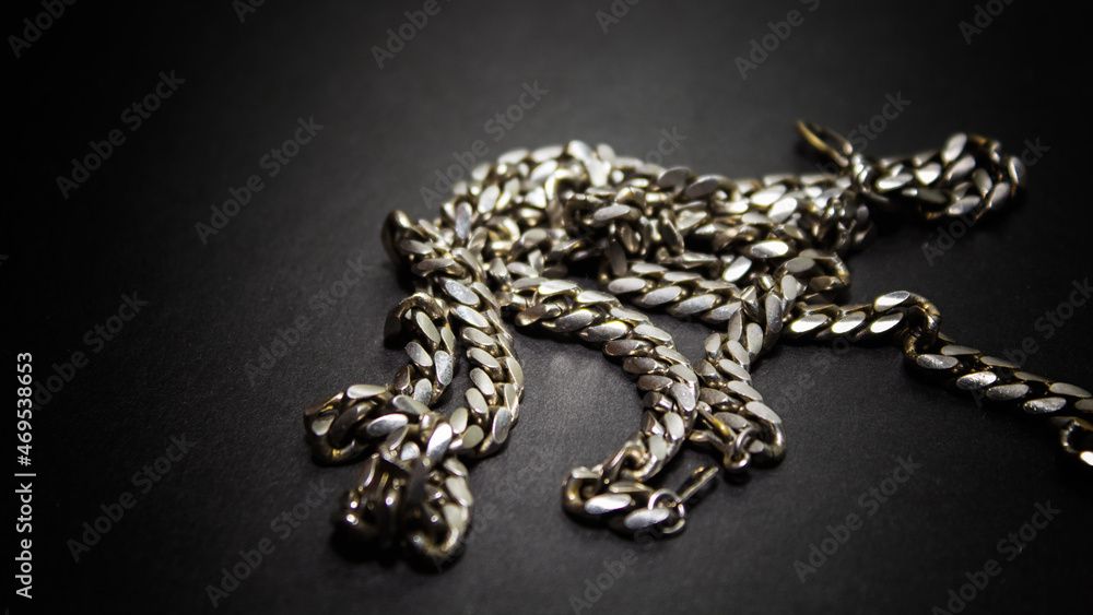 gold chain on a black background gold chain on a black background