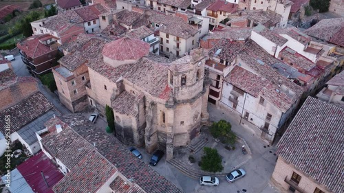 Drone flight over San Salvador church in the small village of Fuentespalda in Teruel, Spain photo