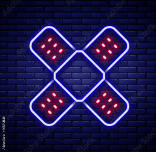 Glowing neon line Crossed bandage plaster icon isolated on brick wall background. Medical plaster, adhesive bandage, flexible fabric bandage. Colorful outline concept. Vector